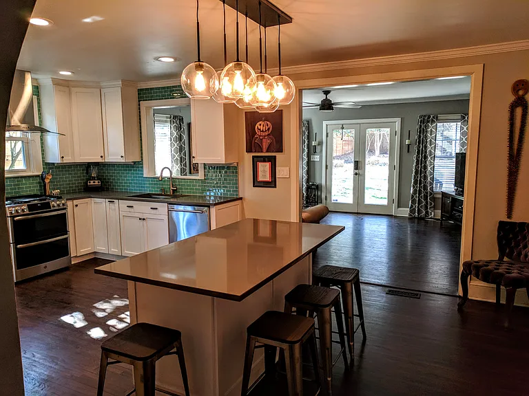 Kitchen showing opening into main living area