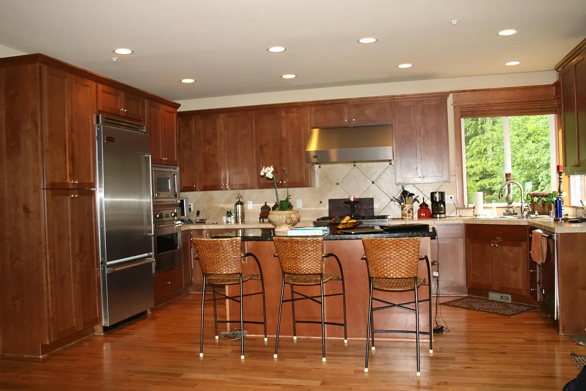 Gourmet Kitchen with top-of-the-line Viking Stainless Steel appliance package & custom cabinets, granite center island, tile backsplash, extensive millwork throughout. - 2339 23rd Ln NE