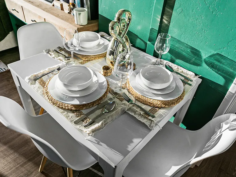 A dining area with all the utensils you need for a perfect dining experience.