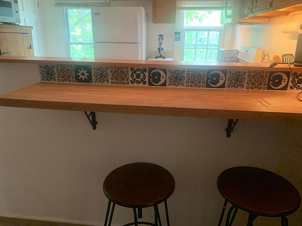 Custom-built breakfast bar. Owner was missing the Southwest, so Mexican tile...