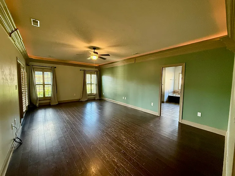 Primary Suite - Walls are grey with green accent wall