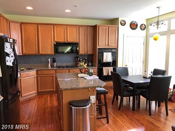 Gourmet kitchen with granite counters, center island, double