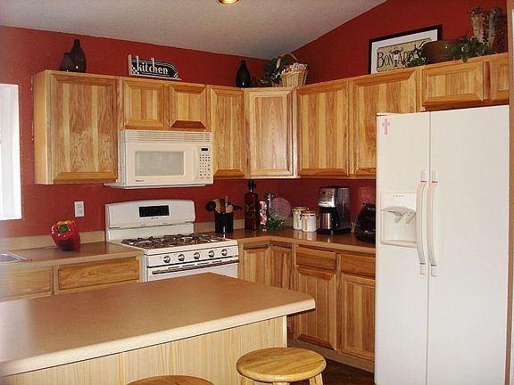 lots of cabinets in this open kitchen