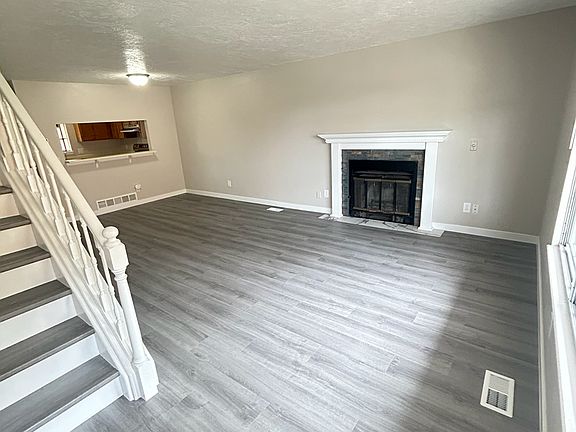 Main Floor living room 12' x 21' with real wood burning fireplace