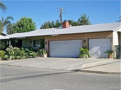 Front view with 3 car garage