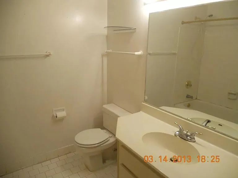 guest bedroom with private bathroom and closet