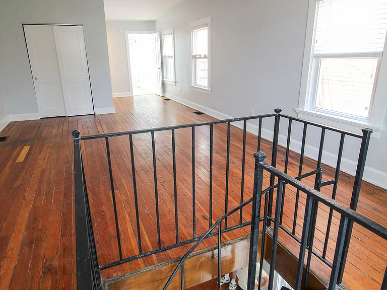 Spiral staircase into main bedroom