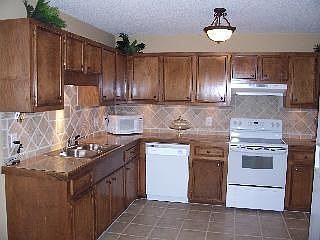 Kitchen with tile floors and granite counters