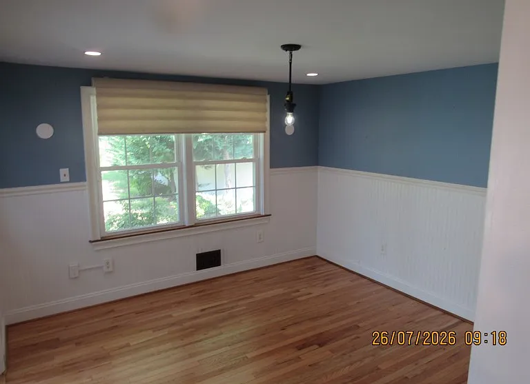 Den off the kitchen which could be a formal dining room which leads to a covered deck