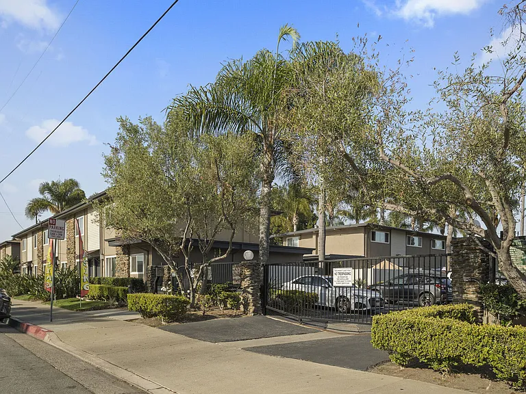 Community entrance at Olive Tree Townhomes in Costa Mesa, CA