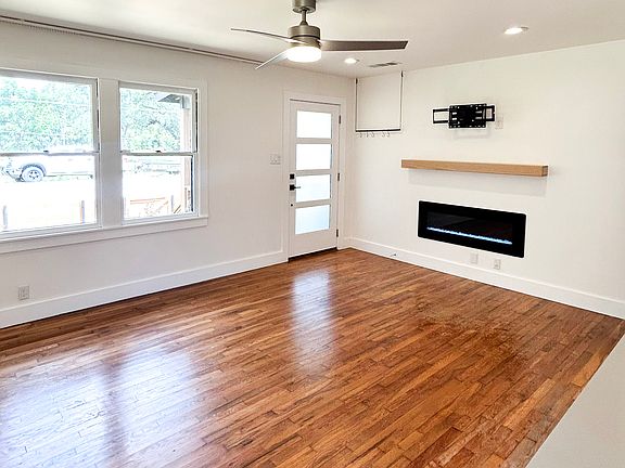 Living room with electric fireplace, and Floating TV mount.