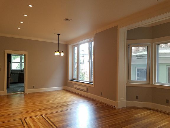 Large living-dining rm, exceptional light, and air. Deep stone sills, hardwood floors, recessed lighting,