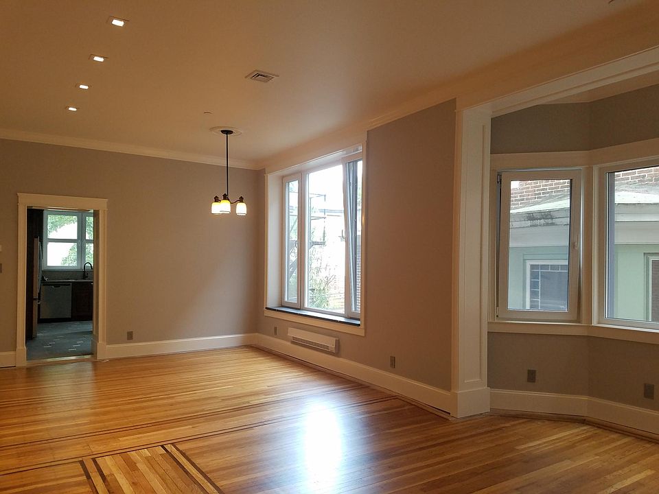 Large living-dining rm, exceptional light, and air. Deep stone sills, hardwood floors, recessed lighting,