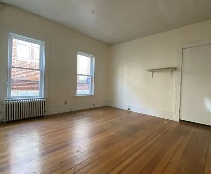 Spacious Living Room with Hardwood Floors.