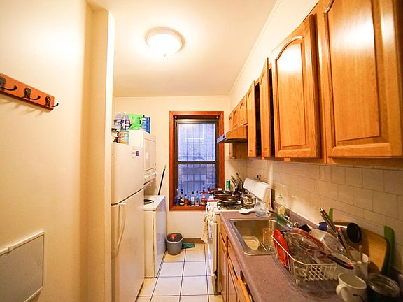 Galley Kitchen with stacked laundry