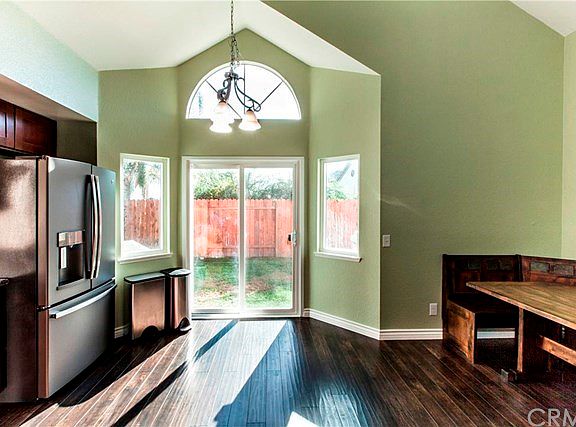 Cathedral ceilings, windows, sliding doors to backyard makes this kitchen open, light and bright