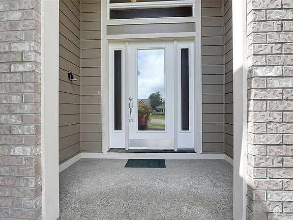 The covered porch leads to the front entry.>
