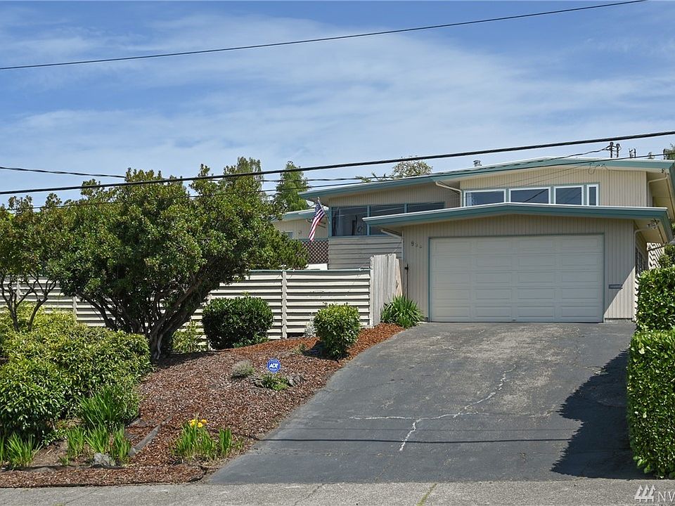 WELCOME HOME!  Panoramic windows with 180-degree beautiful VIEWS of the Olympic Mountains, overlooking the City and Puget Sound.  Huge and open living space of 3450 sq.ft. with 4 bedrooms and 2.75 baths.  Updated and stylish kitchen with white cabinets, butcher block countertops, tile backsplash, laminate flooring, dual wall oven, and a view from the kitchen windows.  Large master suite with a view and a jetted tub in master bath + laundry and bonus/family rooms on upper level.  Fully fenced-in low maintenance yard, very private with gorgeous landscaping and a shop with power.  Complete separate living quarters downstairs with living/dining/kitchen, bedroom and a bathroom.  Very quiet neighborhood with close and convenient access to the Ferry, Hospital and Olympic College.  Tons of storage, two-car attached garage, and security system.  Come see this HOME TODAY!