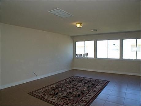 Family room or den. Plenty spacious for entertaining or enjoying family. Notice tile flooring for ea