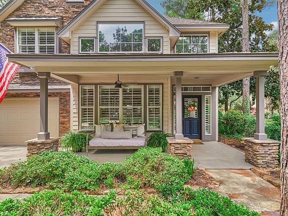 The spacious front porch is wonderful and is surrounded by mature landscaping and trees.