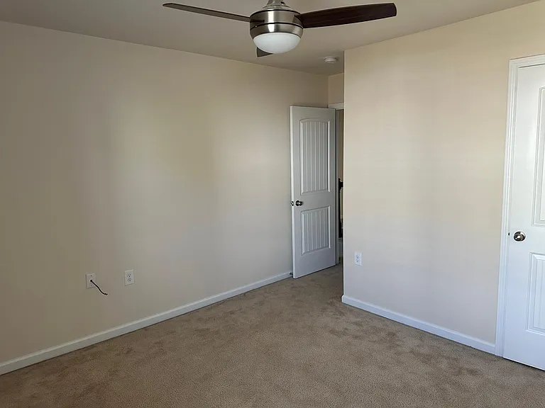 A view from within bedroom 1, the door to the left is out to the hall, the door to the right is the closet. All of the fans inside the house are dimmable and have remotes.