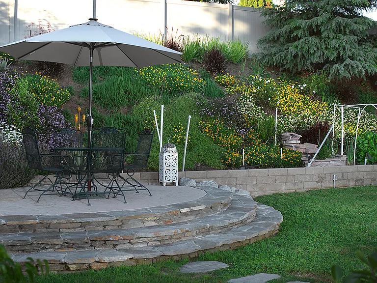 Outdoor patio gardens and seating on an elevated rise