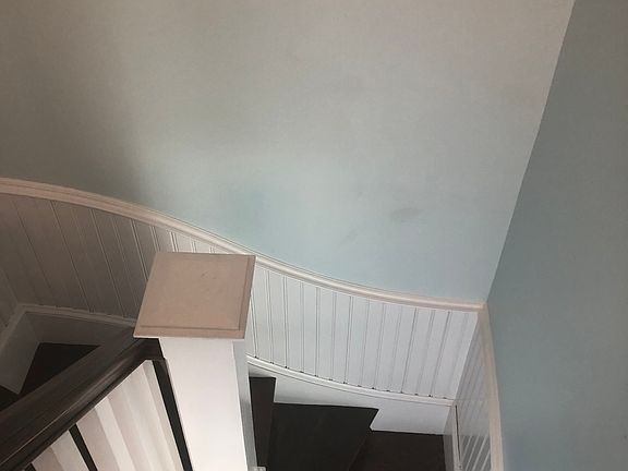 This is looking down. This entire stairway has been fire rated and Jed our master stair builder recreated the curvy wainscotting detail from modern materials. The stairs are original. This was the back staircase or the servant's staircase for the mansion.