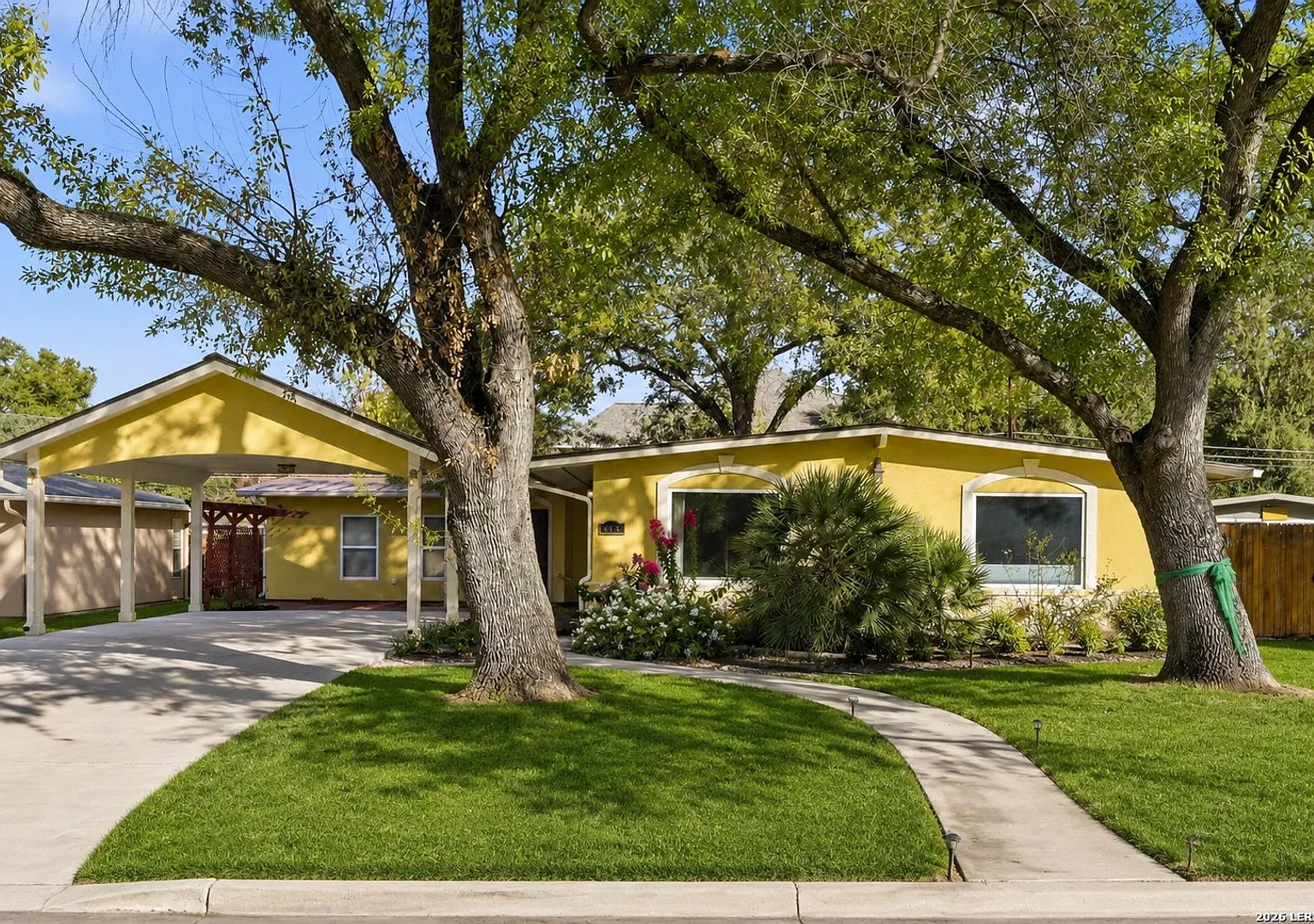 Charming 4-Bedroom Home with Spacious Living Areas in Convenient Location — Photo 1