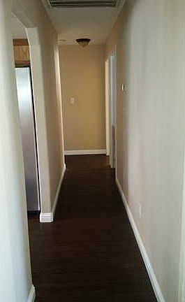 Hall with new floors and baseboards