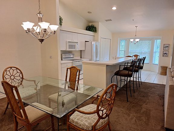 Dining area, kitchen and breakfast nook. Two sets of dimmable lights in dining area and kitchen
