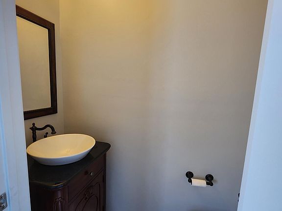 Powder room on 2nd floor has vintage touches