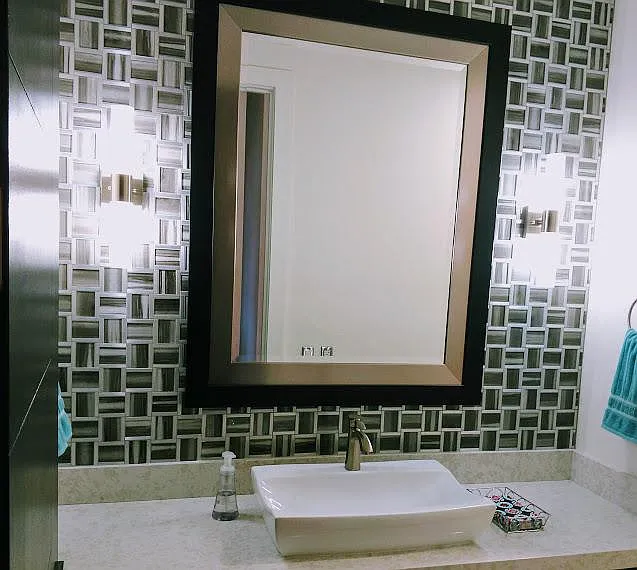 Guest powder room has Art Deco flair