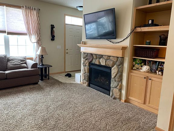 Stone fireplace provides warmth during MN winters.