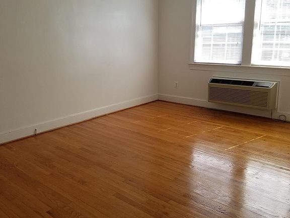 Large living area with hardwood floors