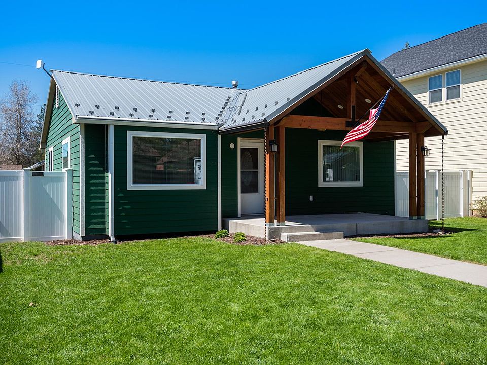 New house exterior color: white with grey trim (lower AC costs than dark green).