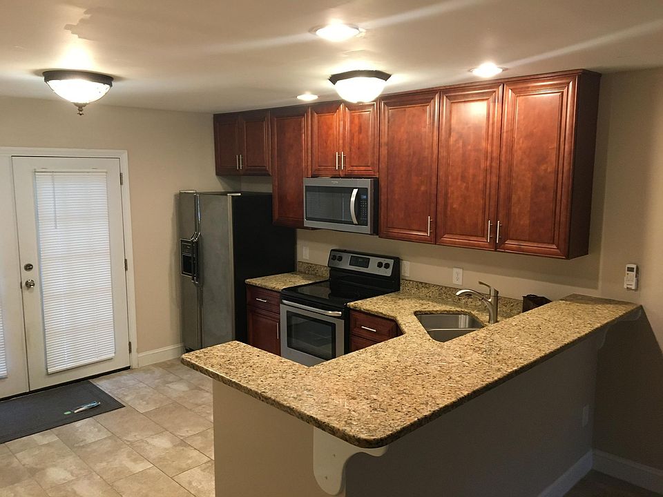 Kitchen with granite countertops, smooth surface stove, plenty of cabinet space, dishwasher, washer & dryer, microwave.
