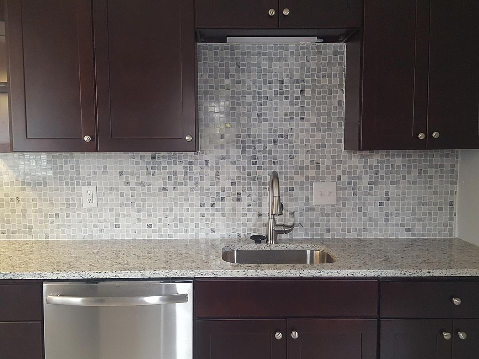 New cabinets, sink, faucet, disposer, granite countertop and back splash.