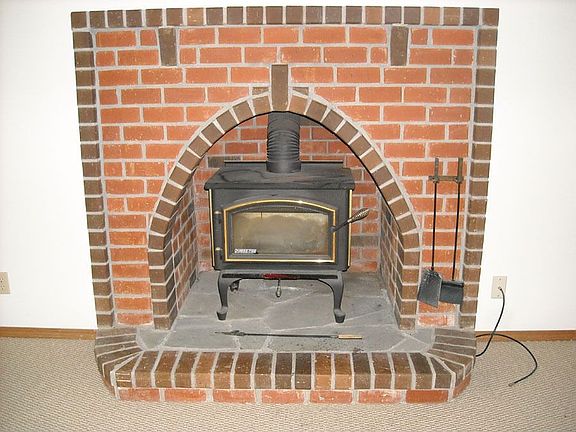 Woodstove in Brick Alcove