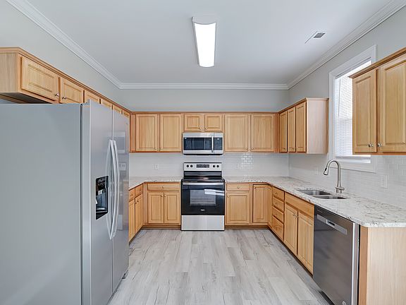 Brand new granite countertops, subway tile backsplash, and SS appliances