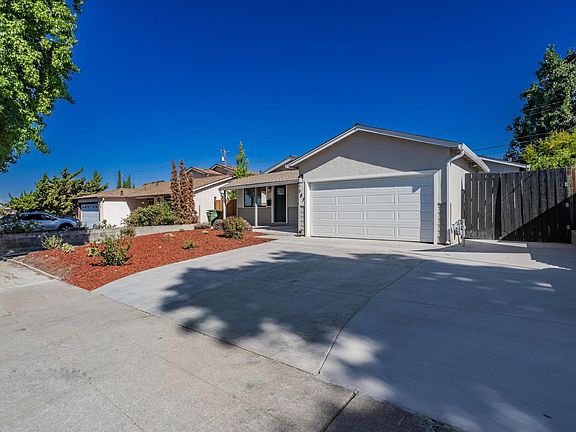 Black gate is the entrance to the back unit with a separate address of 389 Washington Dr
