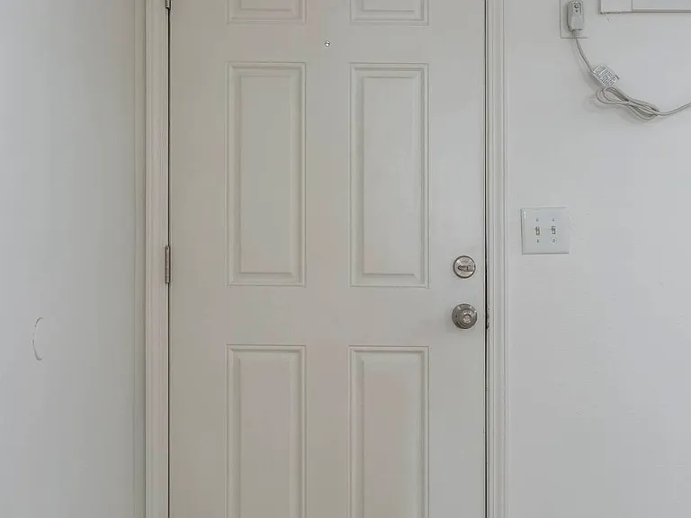 Front interior door in a unit at Cuming St. Apartments.