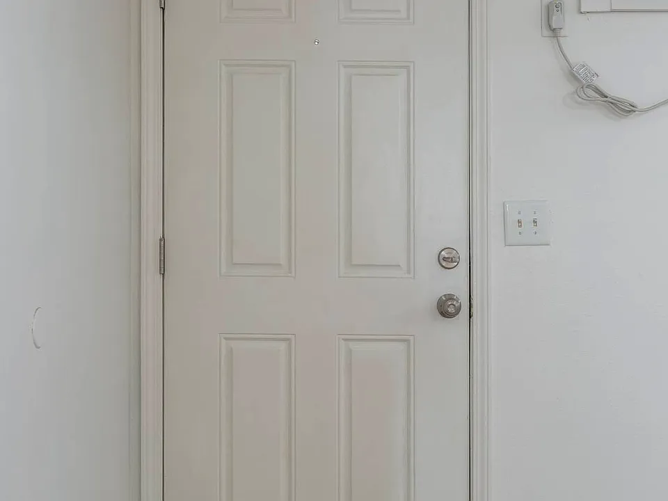 Front interior door in a unit at Cuming St. Apartments.