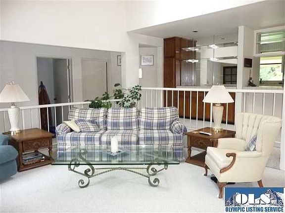 If I were sitting on the couch... I could see the wood burning woodstove, or out the windows to the 