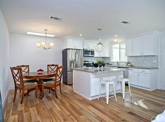 Wood floors add warmth to the seaside inspired interior.