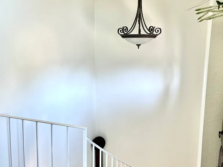 Stairs to upper level. All rooms are on this level. Below is front door entry and access to 1 car garage, along with 2 large closets for storage, one is a large under the stairs type closet.
