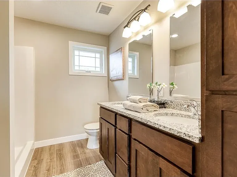 Master Bath With Seated Step In Shower.