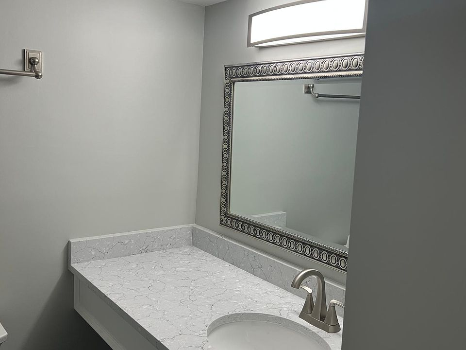 Bathrooms also have granite counter top and under slung sinks.