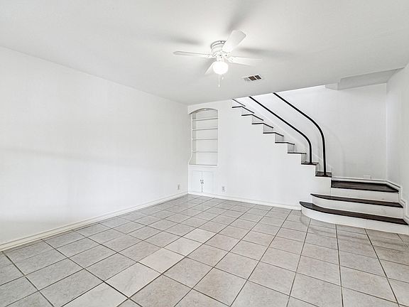 Living Room with built in (just through the flex room)