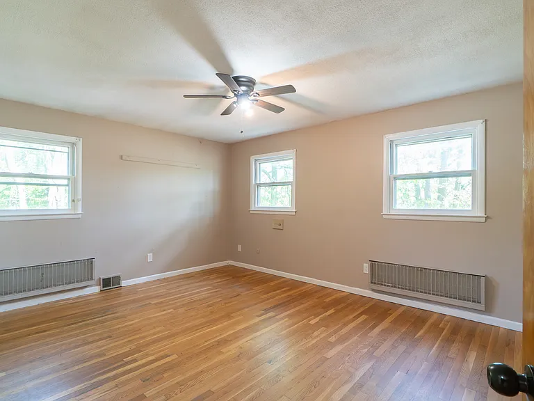 large master bedroom has ceiling fan, ensuite master bathroom, walk-in double closet