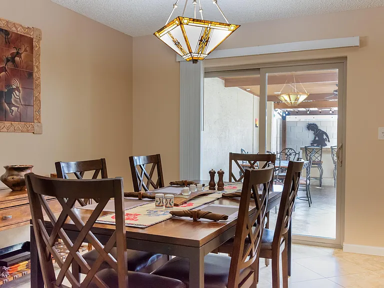 Dining room seating eight (six chairs shown)
